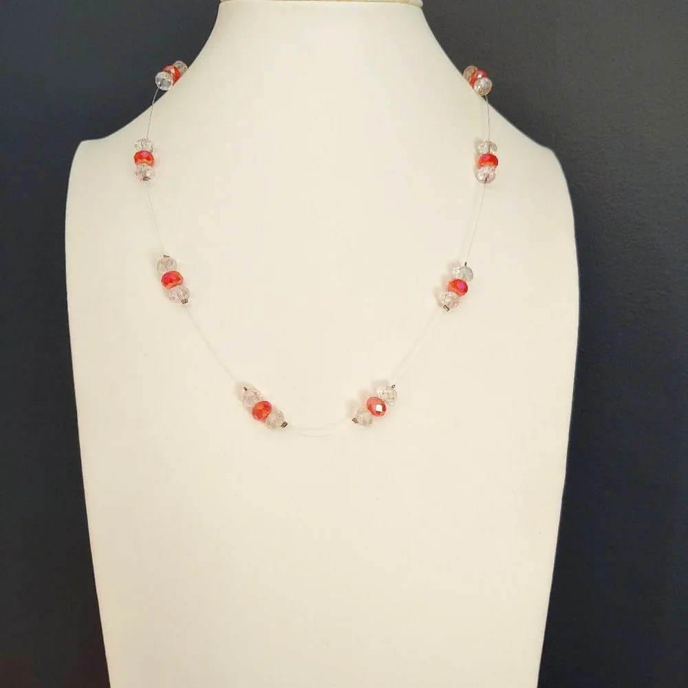 Floating clear and orange crystal necklace